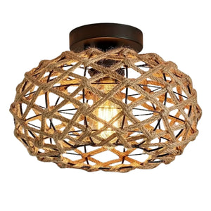 Gros plan sur le lustre en corde de chanvre tressée et structure en métal noir, éclairage LED chaud.