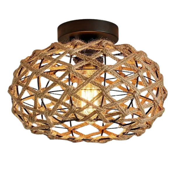 Gros plan sur le lustre en corde de chanvre tressée et structure en métal noir, éclairage LED chaud.